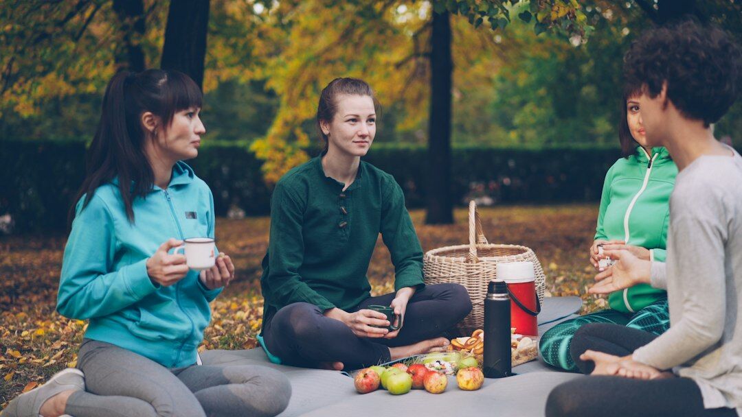group of friends talking outdoors