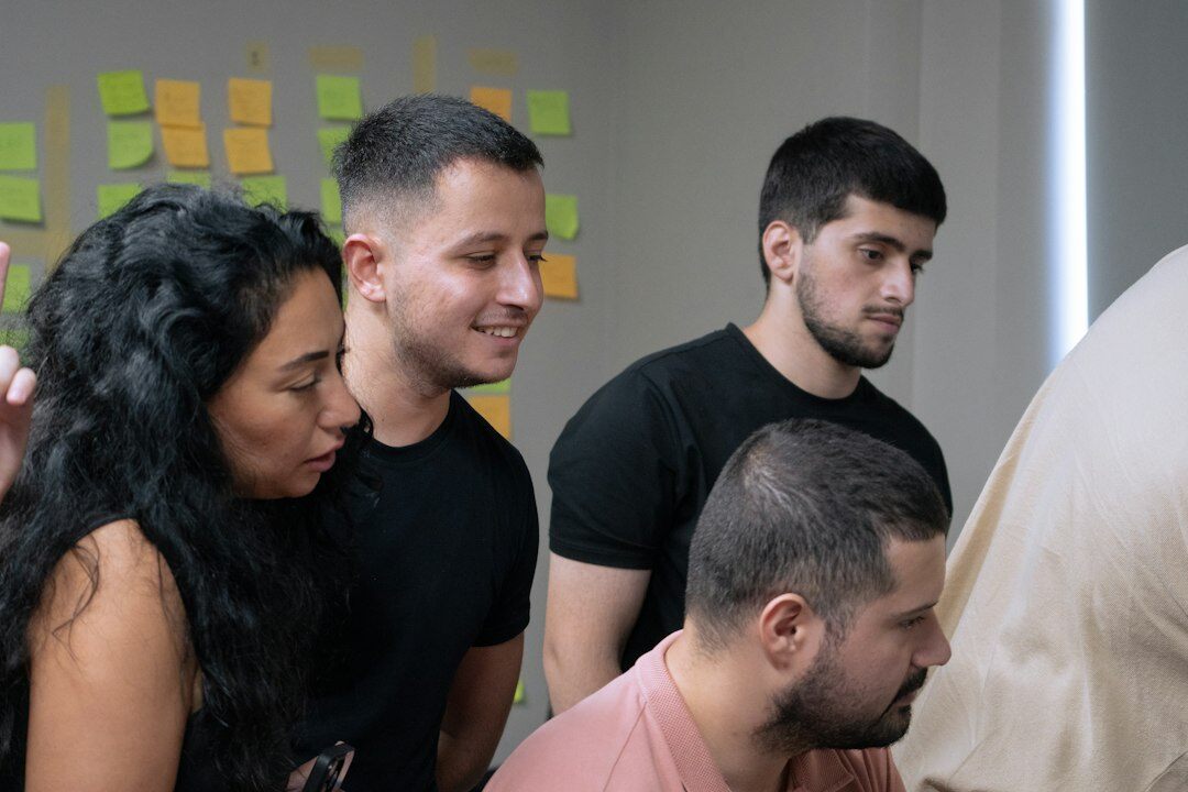 group of young people discussing trends
